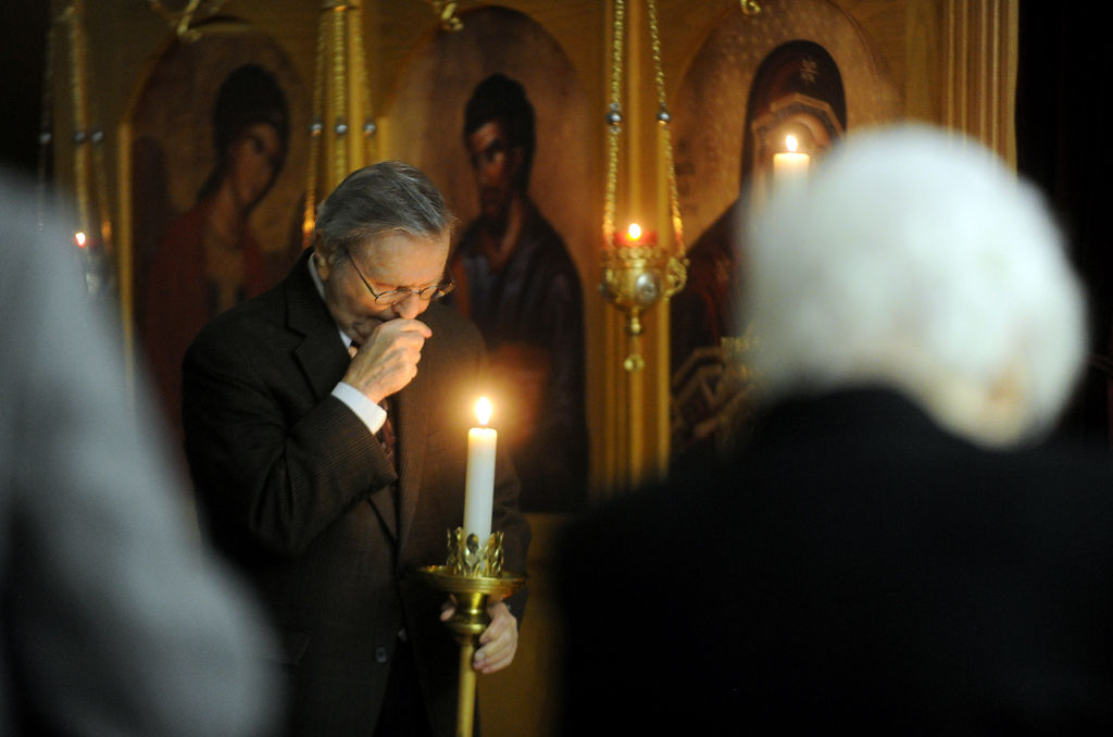Socretes Monos bows his head in prayer